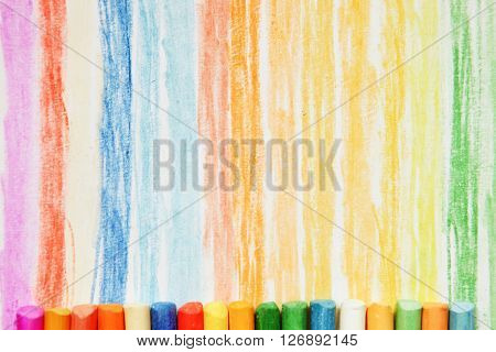 The colored dry postels close up background.