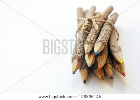 Brown wooden pencils isolated on white baclground.