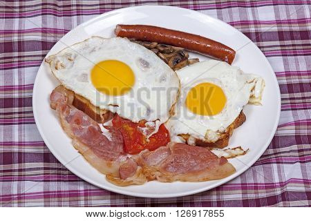 Full Breakfast Of Bacon And Eggs On Toast