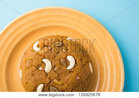 Moong Dal Halwa - a sweet dish from India, Indan Sweet Halwa made from Moong Dal, moong dal sweet sheera or shira cooked in pure ghee, served in a yellow ceramic plate