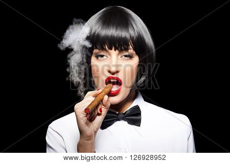 Sexy mafiosi woman smoke with cigar isolated on black