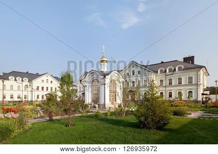 Orthodox temple complex. The chaptel. Architectural lighting. Internal territory of the complex. Street lamp in classic style chapel and bell tower. Sidewalks and landscaping
