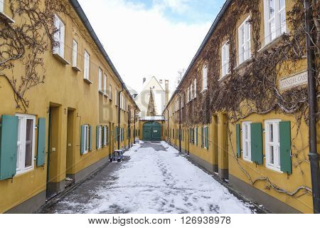 Augsburg Germany - January 17 2016:The Fuggerei is the world's oldest social housing complex still in use. It is a walled enclave within the city of Augsburg Bavaria.