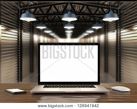 Laptop and smartphone with blank screen on table.