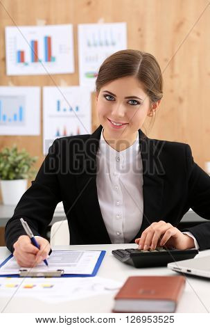 Beautiful Businesswoman Sit At Workplace In Office Work With Papers