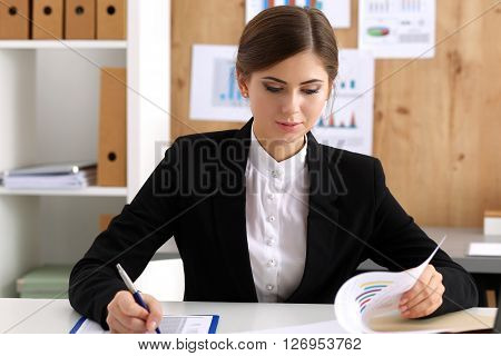 Beautiful Businesswoman Sit At Workplace In Office