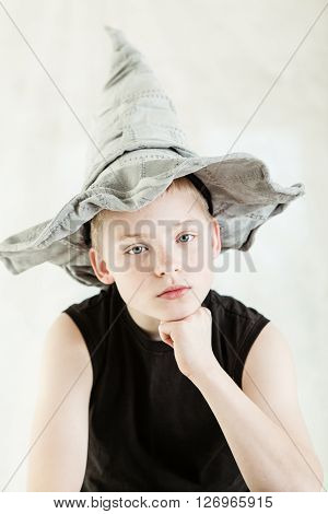 Serious Boy Wearing Gray Pointed Hat
