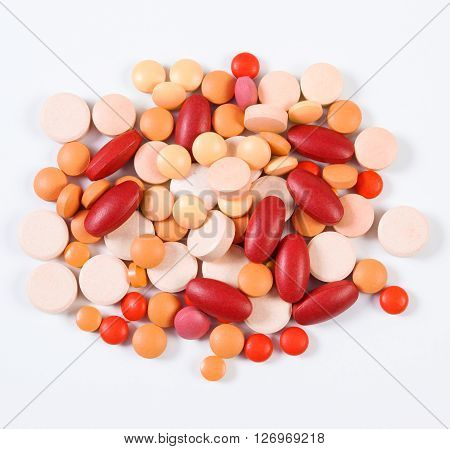 Heap of colorful medical pills tablets capsules or supplements for therapy concept of treatment and health care
