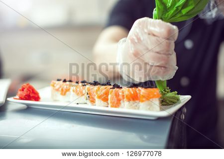 Cooks Preparing Sush