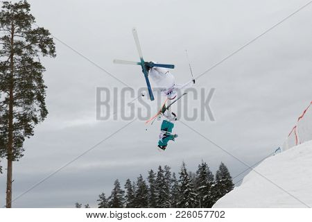 KRASNOE OZERO, LENINGRAD REGION, RUSSIA - FEBRUARY 1, 2018: Albin Holmgren (36) of Sweden and Michail Dolmatov of Russia compete in dual mogul during Freestyle Europa Cup competitions