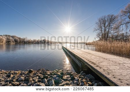 Sun Star Over A Lake