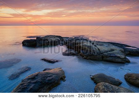 Sea Sunrise At The Black Sea Coast Near Ravda, Bulgaria. Rocky Sunrise.