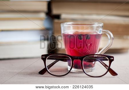 Blueberry Tea To Strengthen Vision With Empty White Paper, Eyeglasses  Against The Background Of Boo