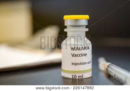 A Malaria Vaccine Vial With Syringe Close Up.