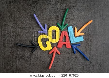 Business Success Target Or Goals Concept, Colorful Wooden Alphabets Goal At The Center With Pointing