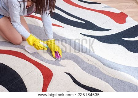A Picture Of Women Hands In Yellow Gloves Cleaning The Floor.