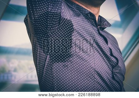 Young Man With Sweating Under Armpit In Business Office - Retro Style