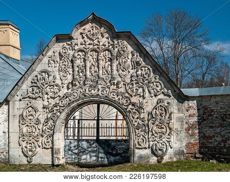 The Facade Of The Building Is White With A Turret, With A Spire Of A Ruinous Architectural Ensemble,
