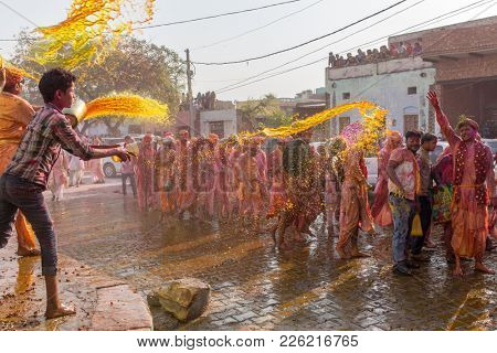 Nandgaon, India - March 18, 2016: Barsana villagers come to Nandgaon village to celebrate Lathmar Holi in Nandgaon, Uttar Pradesh, India.