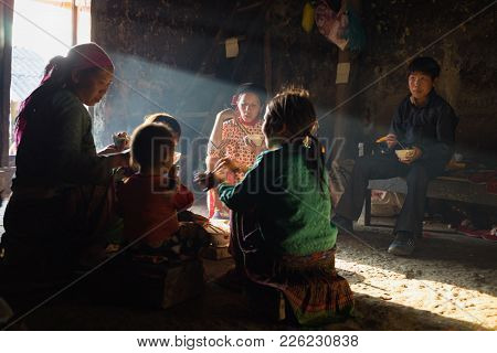 Ha Giang, Vietnam - Feb 13, 2016: H'mong Ethnic Minority Family Having Lunch In Their House In Yen M