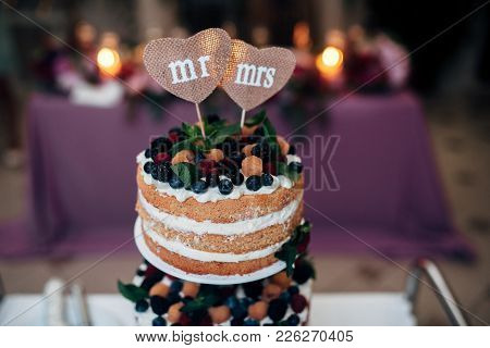 Naaked Wedding Cake With Blueberries, Raspberries And Mint, Two Heart Form Plates On The Top