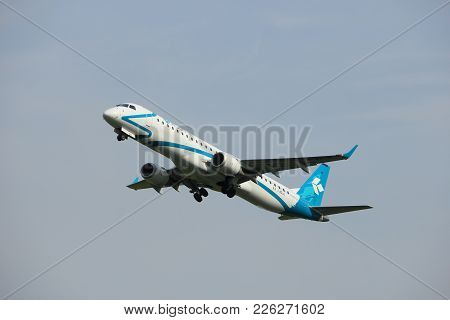Amsterdam, The Netherlands  -  June 2nd, 2017: I-adju Air Dolomiti Embraer Erj-195lr Taking Off From