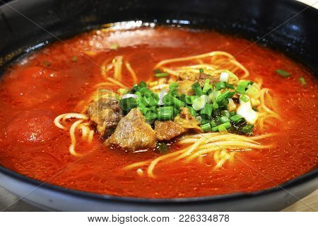 Healthy Chinese Tomato Beef Noodle Soup In Large Bowl