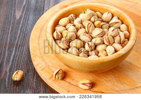 Dish Full Of Pistachios With More Pistachios On Side