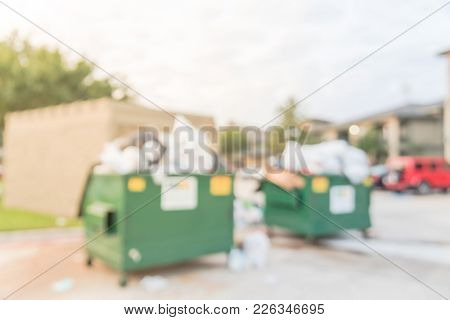 Overflowing Dumpster At Apartment Building Yard In America