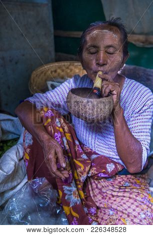 Bagan, Myanmar- Sep 04 : Woman Smoking A Cheroot Cigar In Market In Bagan, Myanmar On September 04, 