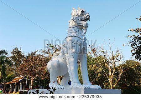 A Beautiful White Lion Statue In The Park