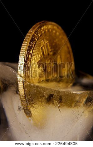 Golden Bitcoin Frozen In The Ice As A Concept Of Restrictions