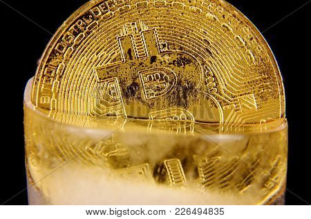 Golden Bitcoin Frozen In The Ice As A Concept Of Restrictions