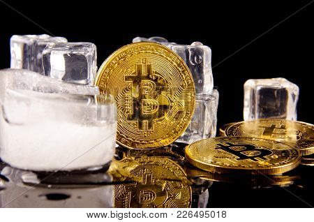 Bitcoin Coin Surrounded By Ice Cubes As A Concept Of Restrictions