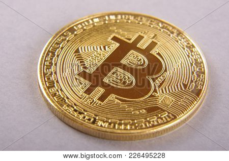 Golden Coin As A Symbol Of Bitcoin Crypto Currency Isolated On The Gray Background