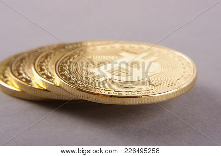 Golden Coin As A Symbol Of Bitcoin Crypto Currency Isolated On The Gray Background
