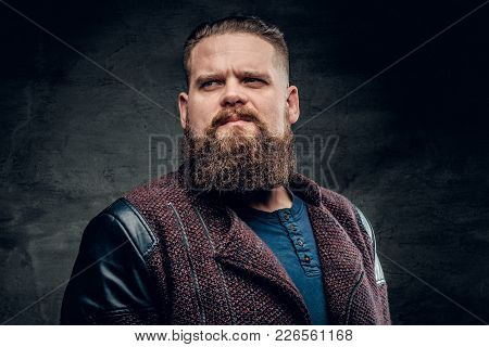 Portrait Of Fat Bearded Male Dressed In A Jacket.