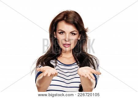Portrait Of Surprised Young Woman Gesturing With Both Hands
