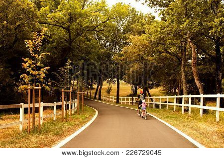 Father And Daughter Going In Bicycle, Family Cyclo Holidays, Summertime. Family, Education, Recreati