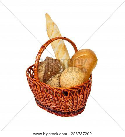 Bread Loaves And Baguettes In A Wicker Basket.