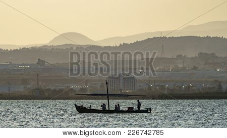 Long Shot Of Tourist Boat At Dusk In Albufera, Valencia