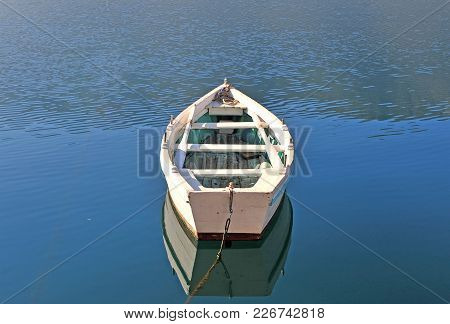 Oldwooden Fisher Boat In The Blue Lake