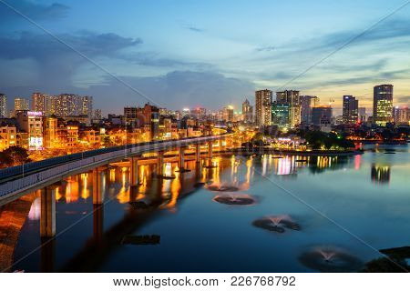 Aerial Skyline View Of Hanoi. Hanoi Cityscape At Twilight At Hoang Cau Lake