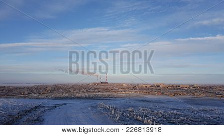 Winter View Of Small Town And Mountain. View Of The Small Town In Winter.