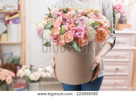 Beautiful Luxury Bouquet Of Mixed Flowers In Woman Hand. The Work Of The Florist At A Flower Shop. C