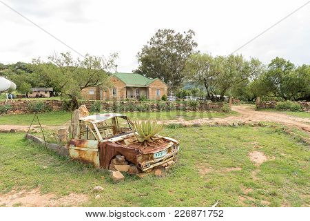 Excelsior, South Africa, February 10, 2018: A Guest House And Old Truck With Aloe Growing In Bonnet 