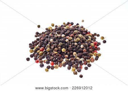 Black, Red And White Peppercorns Isolated On White Background. Heap Of Spice. Mix Of Different Peppe