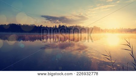 Beautiful Morning Landscape On A River With Mist Over The Water. Amazing Sunrise Over The Lake.drama