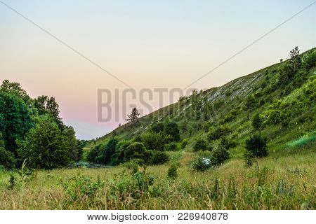 Green Chalk Hills In Evening Time. The Archaeological Monument - Krapivenskoye Ancient Settlement, B