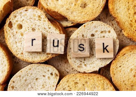 Word Rusk On Many Of Round Rusk Background.